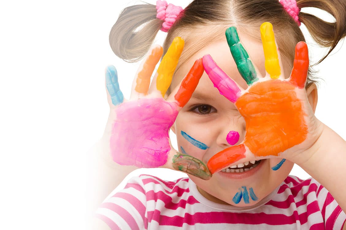 Child with painted hands at Brown Bear Day Care